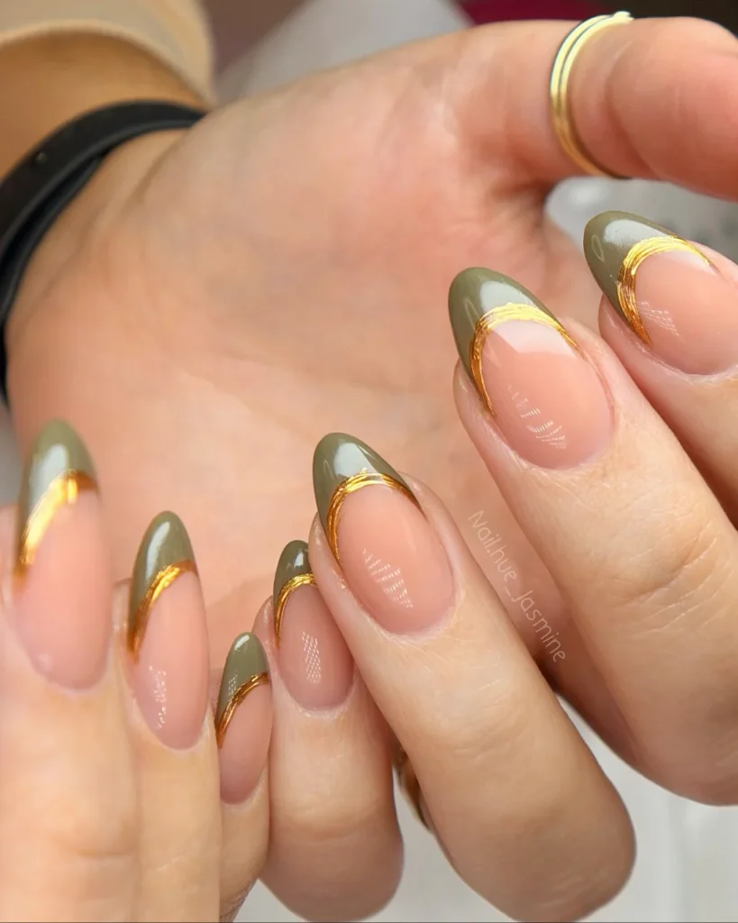 Green Christmas French tip nail designs with olive green tips, nude pink bases, and curved gold foil accents.