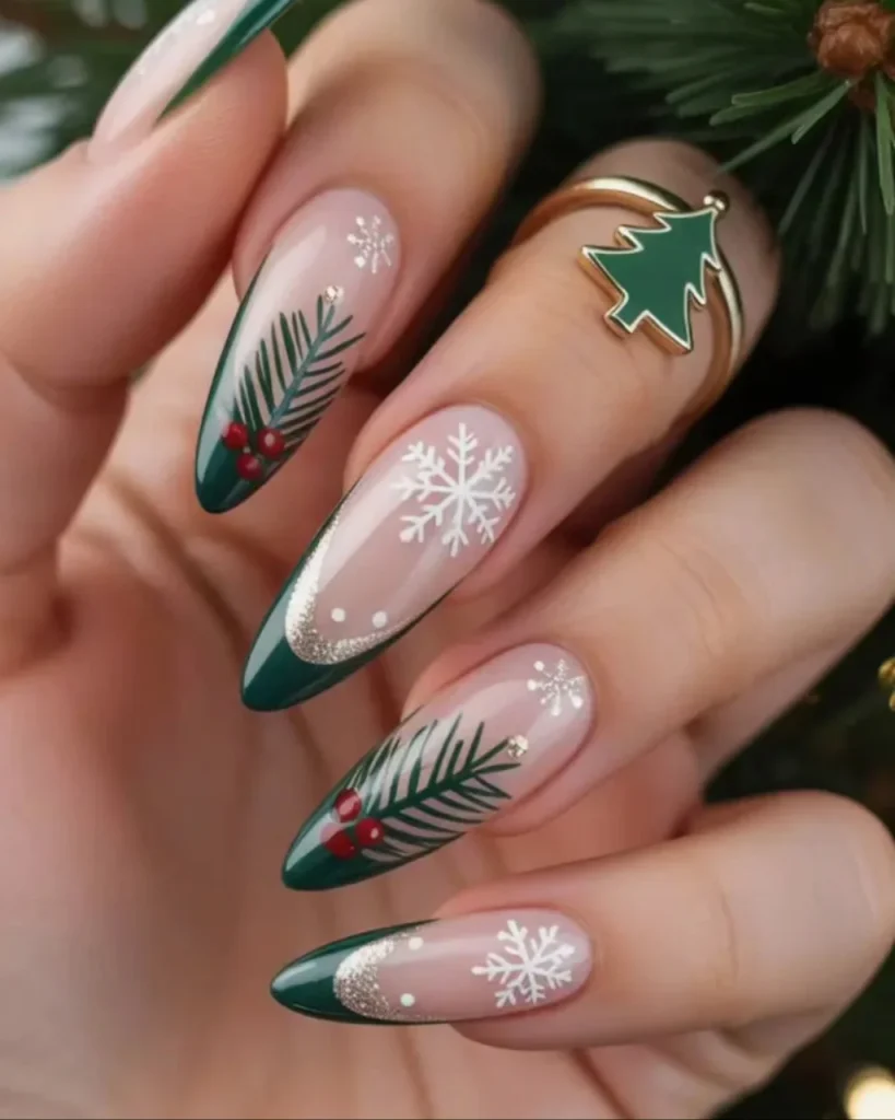 Green Christmas French tip nail designs with deep green tips, nude pink bases, white snowflakes, pine branches, red berries, and gold glitter accents.