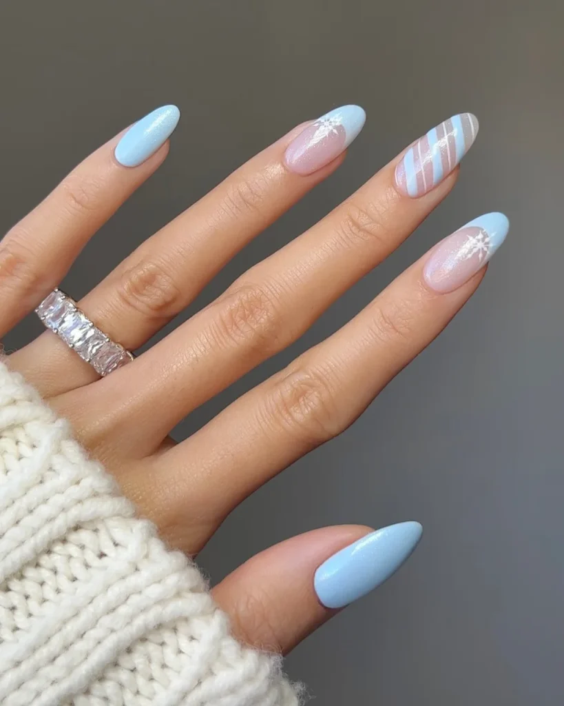 Light pink Christmas nails featuring delicate winter-inspired nail art, soft pink shades, and an elegant, polished festive finish.