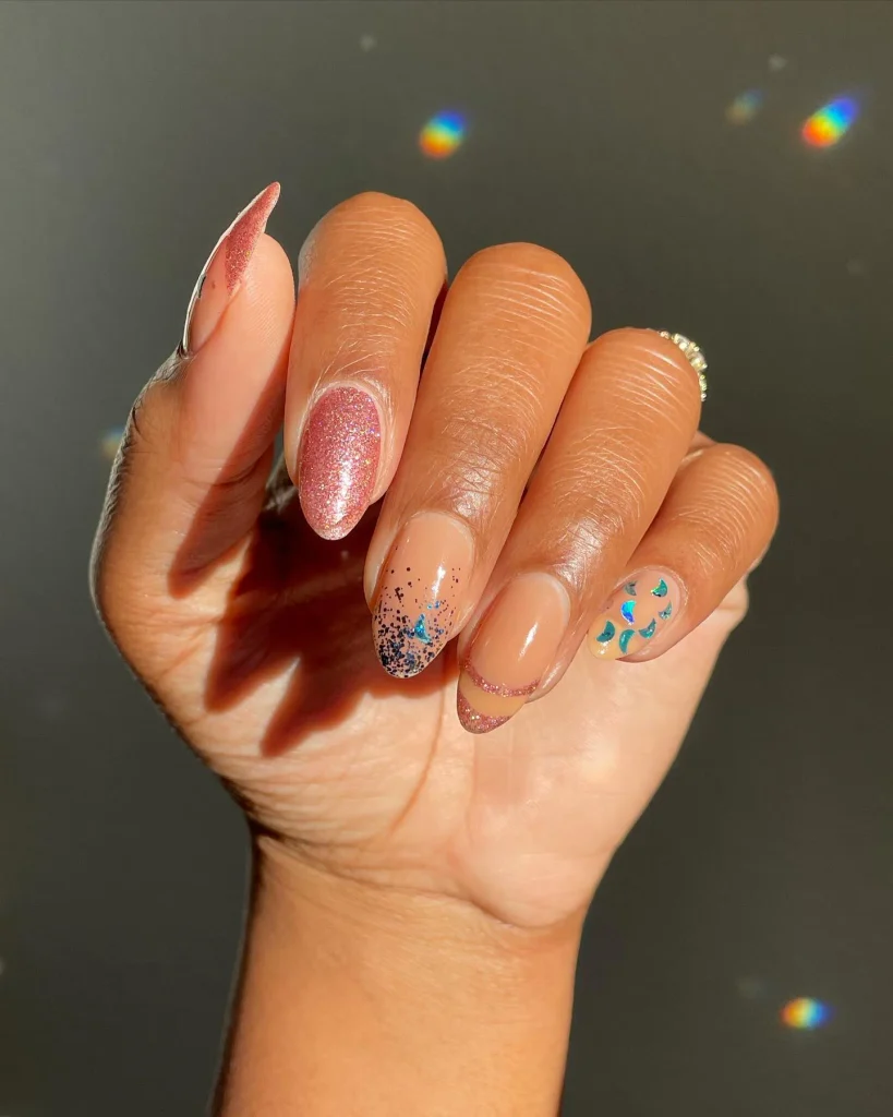 Milky pink Christmas nails with a soft pearlescent shimmer, delicate white snowflakes, and subtle festive accents.