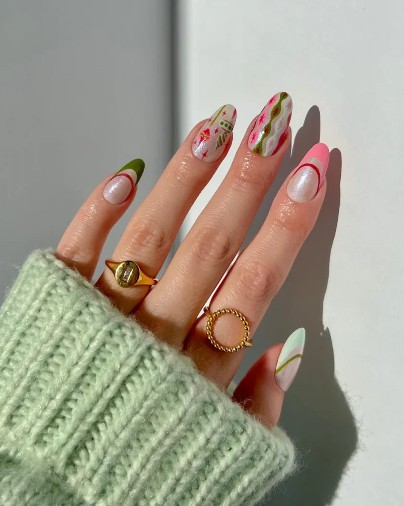 Vintage pink Christmas nails featuring muted green accents, retro ornament patterns, and festive wrapping-paper-inspired nail art.